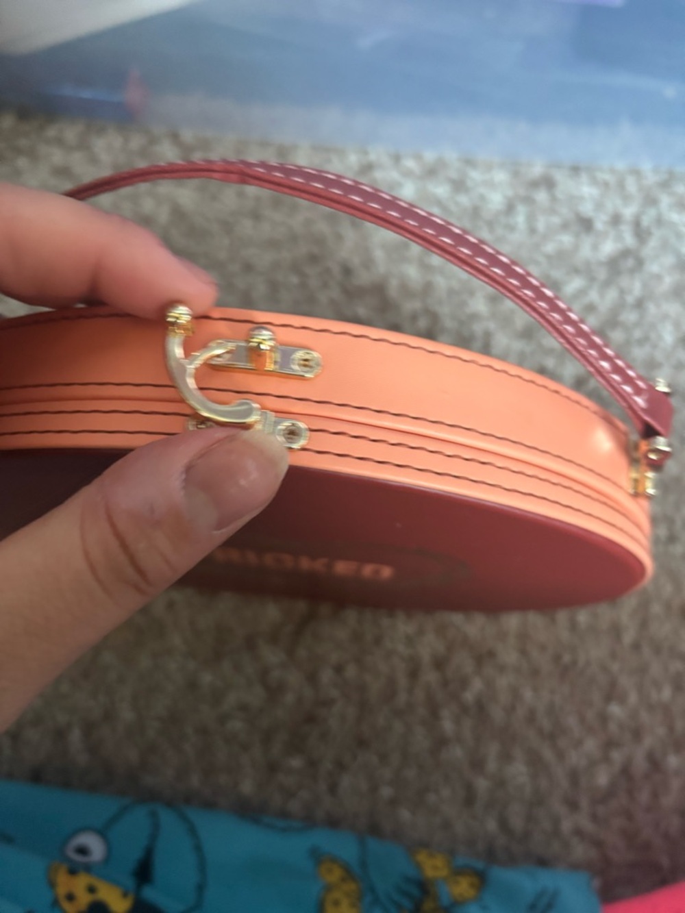 Round Maroon 'PRICKED' Handbag with Gold Heart Detail - Picture 2 of 6